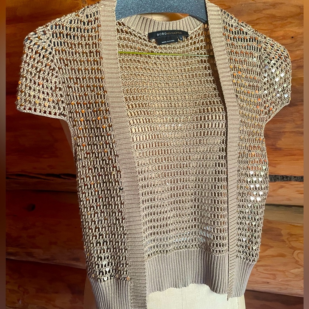 Cute vintagey shrug. Perfect over a dress for a special occasion.